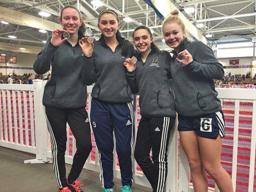 POSING with their fourth-place medals earned at the MSTCA Div. 5 Indoor State Relays are members of the Pioneers girls' sprint medley relay team, from left: captain Kate Mitchell, captain Lilli Patterson, Danielle Percoskie and Lilly Rothwell. (Courtesy Photo)