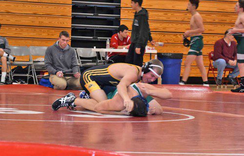 JUNIOR Anthony Wilkinson (on top) pinned his 182 lb. Canton opponent in 4:21 during the Black and Gold’s 42-39 victory over Canton Jan. 21. (Courtesy Photo)
