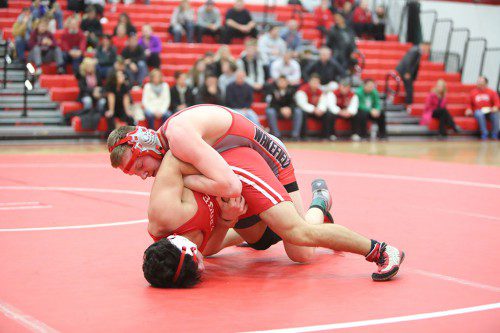 JACK SPICER, a senior (top), earned a pair of victories in Wakefield’s tri-meet against Wilmington and Saugus on Saturday at the Charbonneau Field House. (Donna Larsson File Photo)
