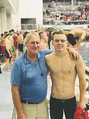 MELROSE HIGH senior Joe Connolly (pictured with coach Richard Whitworth) broke the 100 butterfly record at MHS set in 1995 while he competed at the Div. 2 State Finals on Saturday. He swam a 54.84.(courtesy photo)