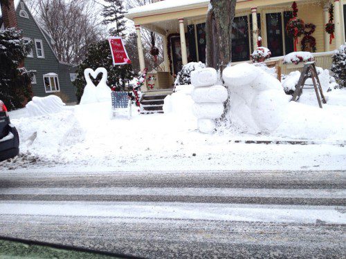THIS YARD ON PLEASANT STREET has a few stories to tell, including one about Valentine’s Day and how Old Man Winter has a firm grip on all of us. More great work from sculptor Wade Parsons! (Photo courtesy of Dick’s Video)