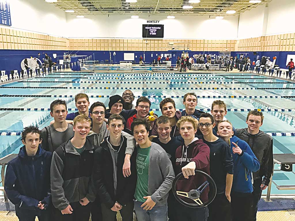 MEMBERS OF the Melrose High boys’ swim team celebrate a successful day at the Middlesex League meet at Bentley University on Feb. 2. (courtesy photo)