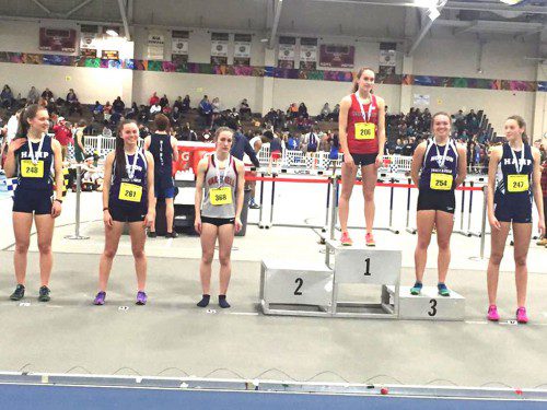 ABBY HARRINGTON, a senior (third from left), placed fifth in the 600 meter run as she posted a time of 1:41.26 in the Div. 4 Indoor Track and Field Championship Meet on Thursday at the Reggie Lewis Center.