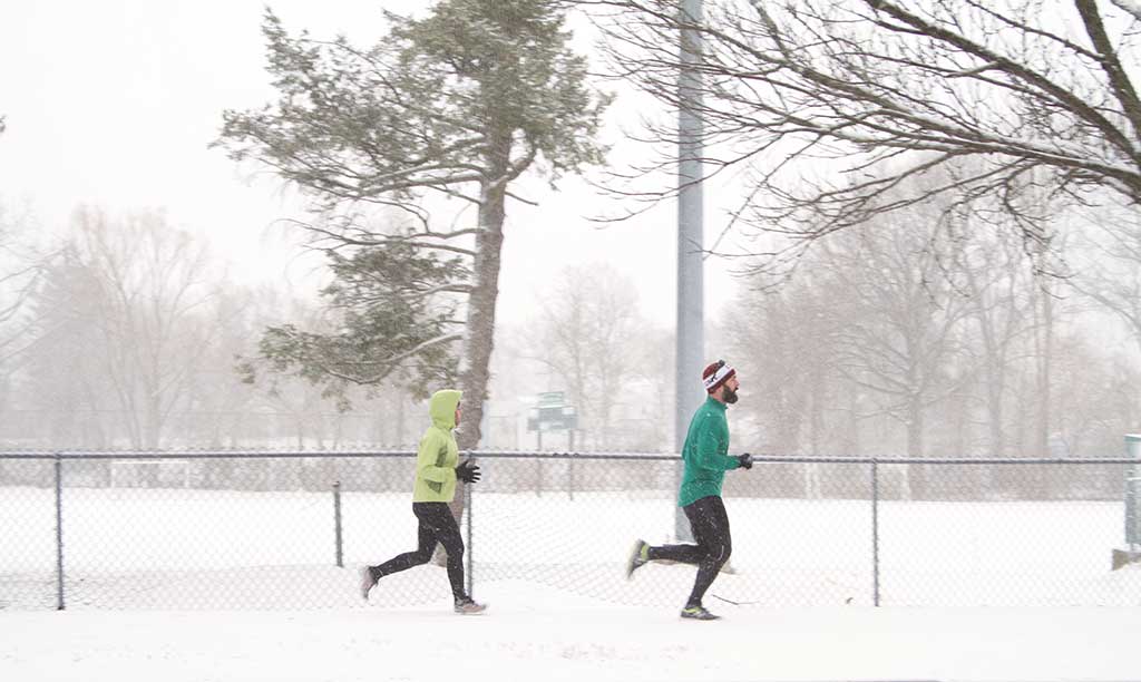 TWO dedicated joggers decided the perfect time to go for a run on the Lynn Fells Parkway was during Tuesday’s nor’easter. (Donna Larsson Photo)