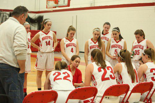 THE WMHS girls’ basketball team goes over its game plan during Friday night’s Div. 2 North quarterfinal win over Tewksbury. The Warriors are hoping to come up with the right strategy against Hamilton-Wenham when they face the Generals tomorrow night in the North semifinals. (Donna Larsson Photo)