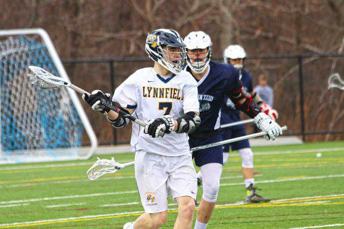 CAPTAIN Peter Look (7) scored three goals and had one assist during the boys’ lacrosse team’s 15-0 victory over Pope John April 7. (Kerrianne Allain Photo)