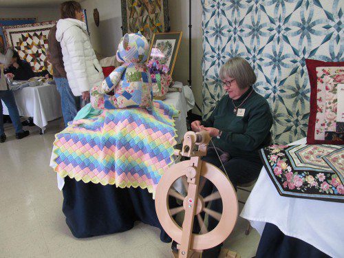 WAKEFIELD ARTS and Crafts Society President Nancy Smethurst is shown spinning wool into yarn.  (Gail Lowe Photo)