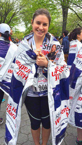 CELEBRATING at the finish line, Mackenzie Dolbeare competed in the 14th annual Shape Women’s Half-Marathon held in NYC April 30. (Courtesy Photo)