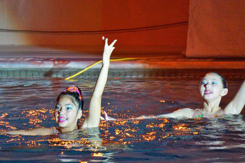 Xavia Banigan of North Reading (left) performing in a synchronized swimming duet routine with Bonnie Li from Concord. (Courtesy Photo)