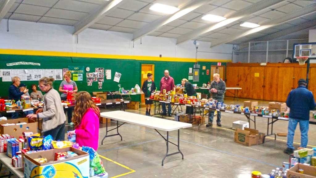 Volunteers met the North Reading Food Pantry last Saturday to sort out the nearly two tons of donated food items that local letter carriers gathered during the annual U.S. Postal Service “Stamp Out Hunger” food drive. (Courtesy Photo)
