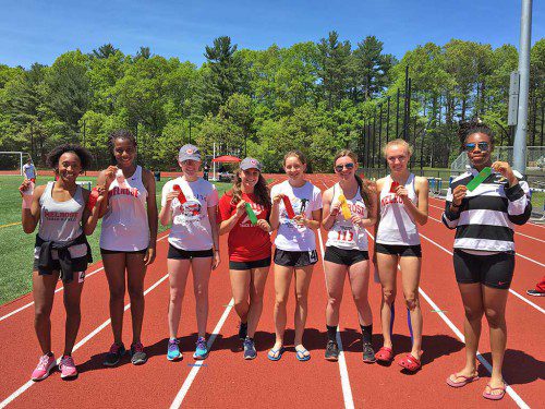 AMONG THOSE who medaled for the MHS girls' outdoor track team at their recent Last Chance meet were: (from left) Giovana dos Santos Machado, Bridget McDonnell, Molly Clark, Kate Bidgood, Katie Donovan, Holly Moore and Emily Otaluka. (courtesy photo) 