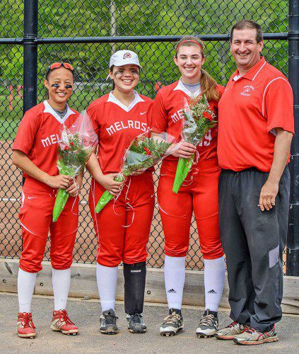 MELROSE SENIOR captains (from left) Rachel Pfeiffer, Josephine Andruskiewicz and Victoria Crovo (pictured with coach Steve Wall) were honored on Senior Day on Tuesday. (Steve Karampalas photo)