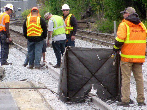 A CREW FROM KEOLIS was making much needed upgrades and repairs to the commuter rail crossing at North Avenue and Albion Street over the weekend. (Mark Sardella Photo)