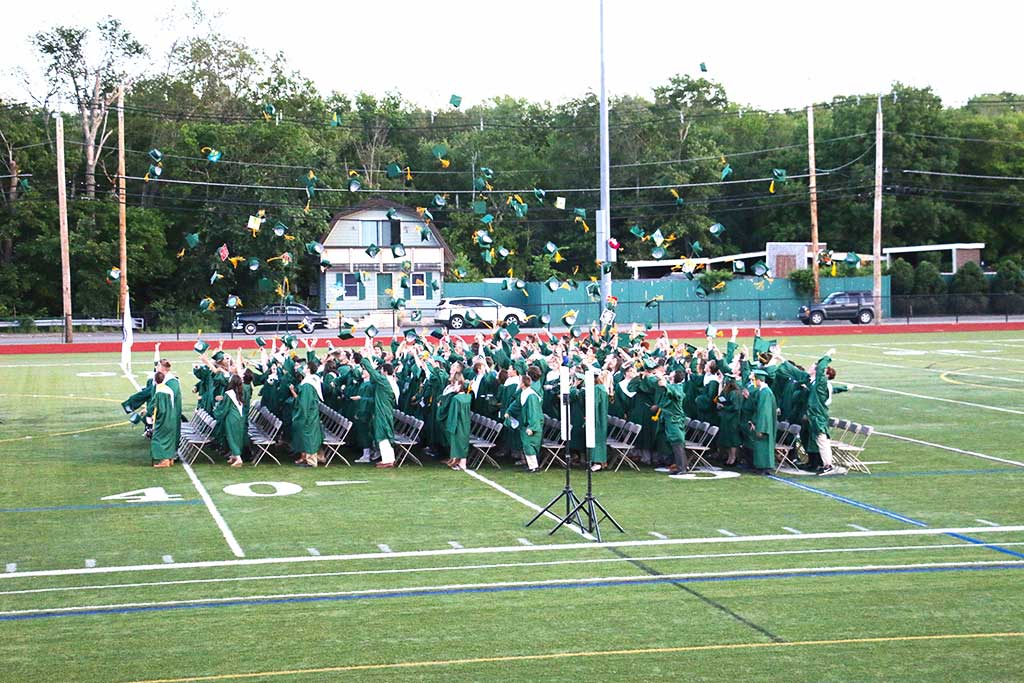 Members of the North Reading High School Class of 2017 make their way into their commencement ceremony last Friday evening.  (John Friberg photo)
