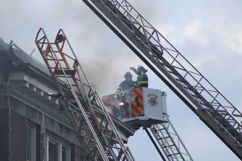 Many fire departments from the surrounding area assisted Reading in fighting the seven-alarm fire at a condominium building on Sanborn Street. (Keith M. Curtis)
