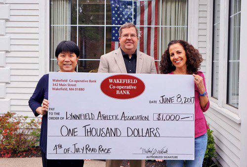 Sam Lai, AVP, Branch Manager of 596 Main Street office; Michael Wolnik, President & CEO of Wakefield Co-operative Bank; Andrea Braconnier, Lynnfield Athletic Association.