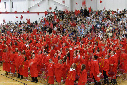 THE WMHS CLASS OF 2017 celebrates with the traditional toss of their caps into the air. (Mark Sardella Photo)