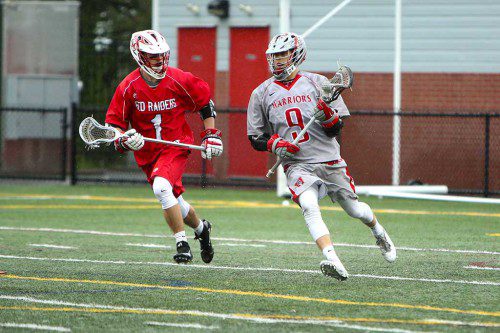 PAT LEARY, a senior attackman (#9), scored the game-winning goal for the Warriors in their 12-11 Div. 2 North semifinal win over Melrose last night at Landrigan Field. On the right is Melrose senior Mike Calvert. (Donna Larsson Photo)