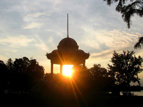 THE SETTING SUN seen through the silhouette of the Bandstand on Sunday. (Mark Sardella Photo)