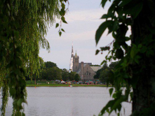 THE TOWER of the First Parish Congregational Church and the steeple of the First Baptist Church framed by trees on the east side of the Lake. (Mark Sardella Photo)